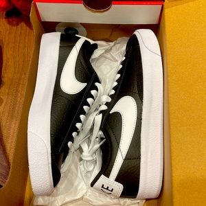 Black black and white Nike sneakers